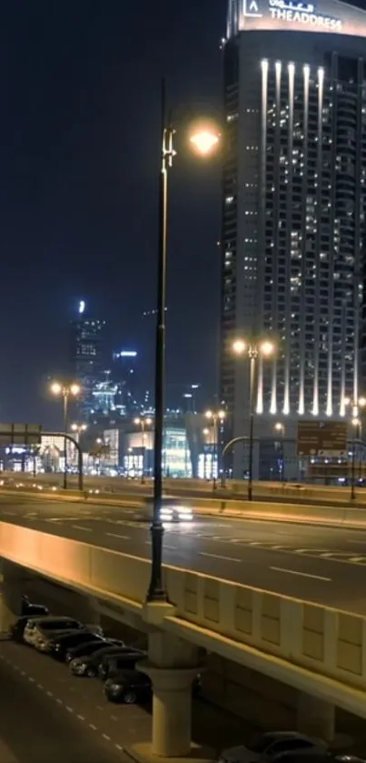 Night view of a cityscape with towering skyscrapers and illuminated streets.