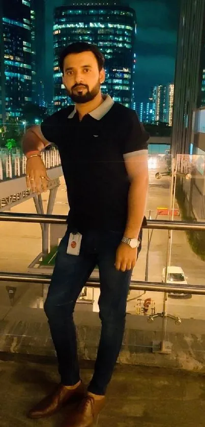 Man standing by railing with urban nightscape background.