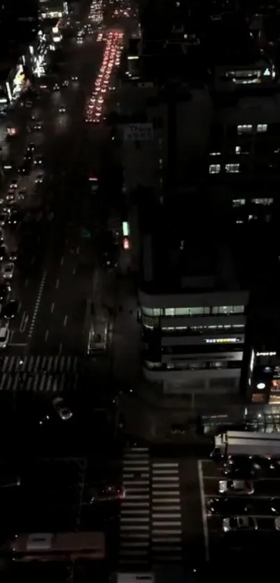 City street illuminated at night with vibrant lights and cars.