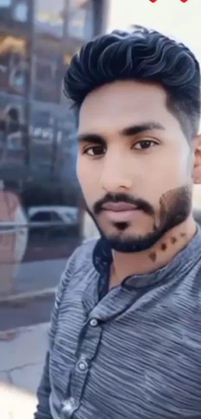 Young man posing in urban setting.