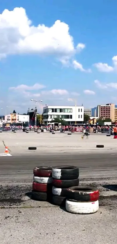 Urban racing event with blue sky and city backdrop.