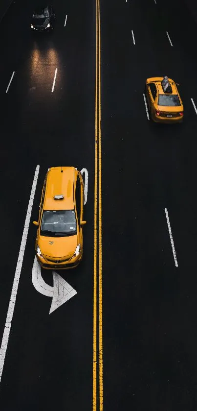 Yellow taxis on a dark urban road, perfect for mobile wallpaper.