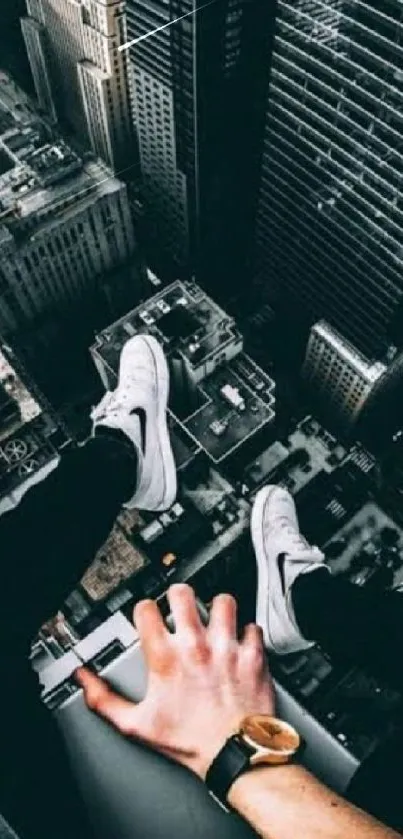 Person sitting on a skyscraper ledge with city view.