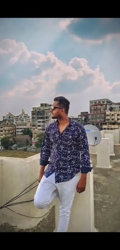 Stylish urban rooftop view with city skyline and cloudy sky.