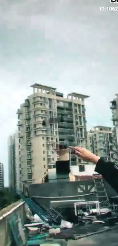 Rooftop view of towering urban skyscrapers against a cloudy sky.