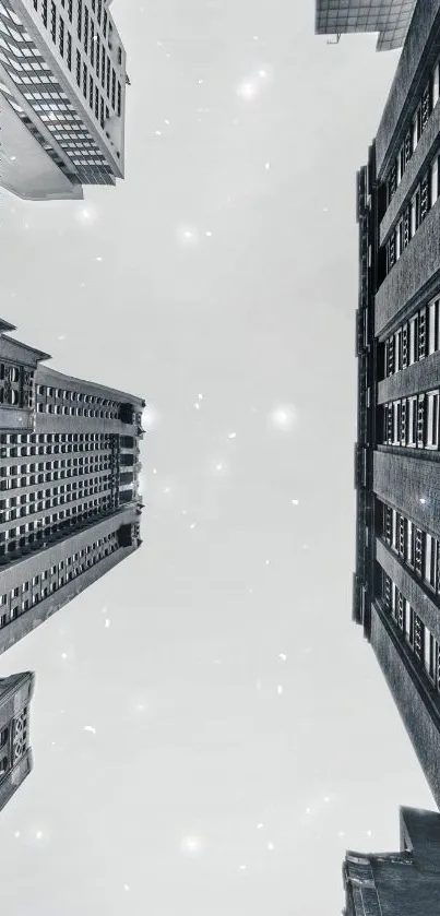 Skyward view of urban skyscrapers against a gray sky.