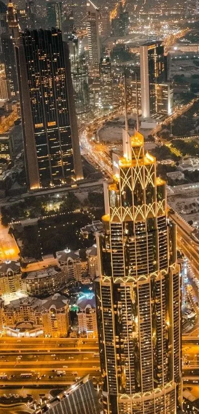 Aerial view of illuminated skyscrapers and city streets at night.