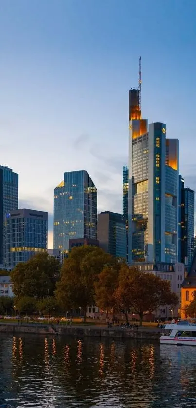 A city skyline at dusk with skyscrapers reflecting in the river.