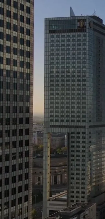 Evening skyline with towering skyscraper and urban architecture.