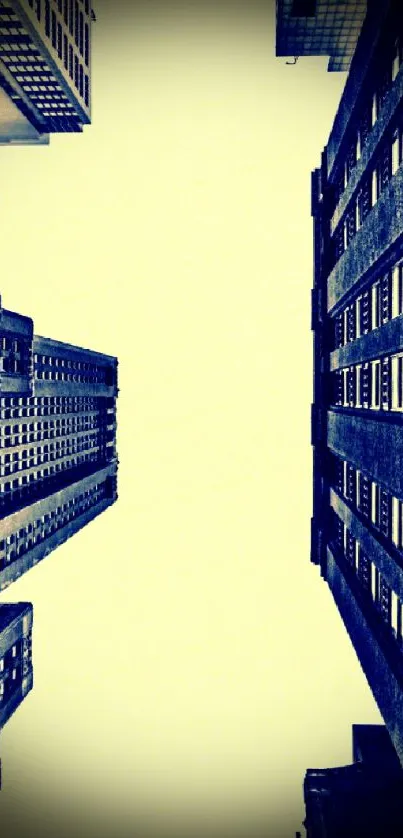 Urban skyscraper skyline view from below with yellow sky and towering buildings.