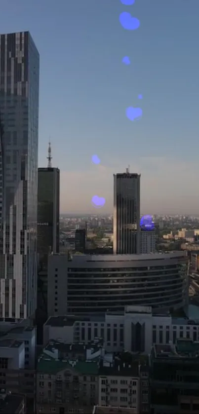 Twilight view of skyscrapers against a serene blue sky with city lights.