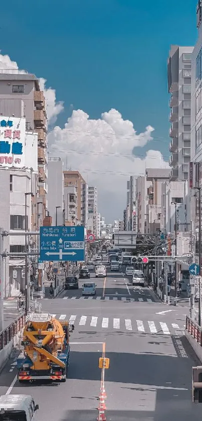 Urban street view with cars under a blue sky.