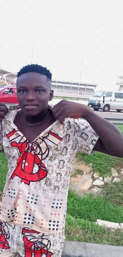 Young man showcasing urban street fashion outdoors.