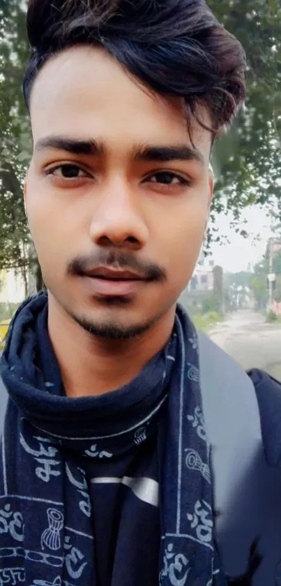 Portrait of a young man with urban fashion in a natural street setting.