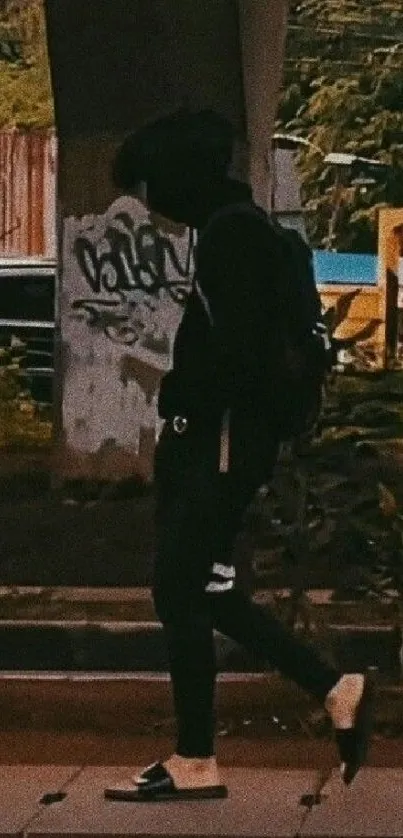 Person in urban street style walking under a bridge.