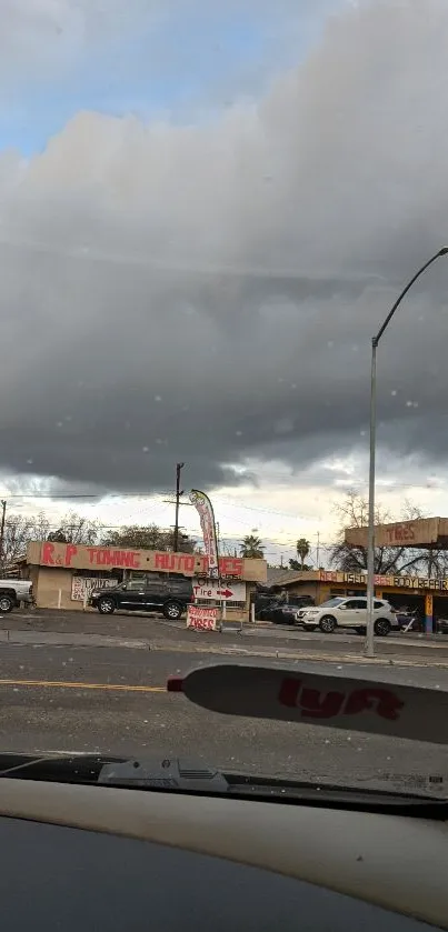 Urban street view with cloudy skies.