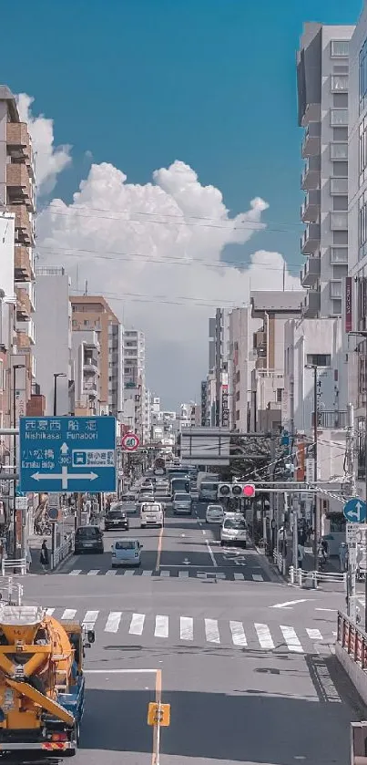 Vibrant city street with skyscrapers and blue sky.