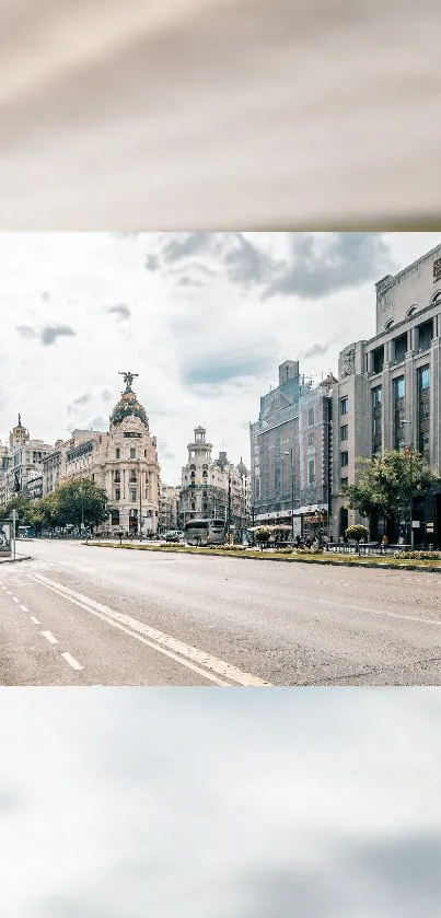 Scenic urban street view with elegant architecture and cloudy sky.