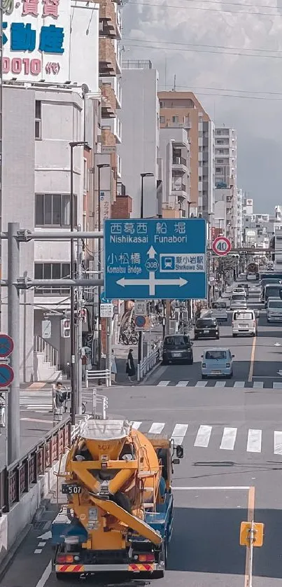 Urban street scene with blue sky and modern buildings.