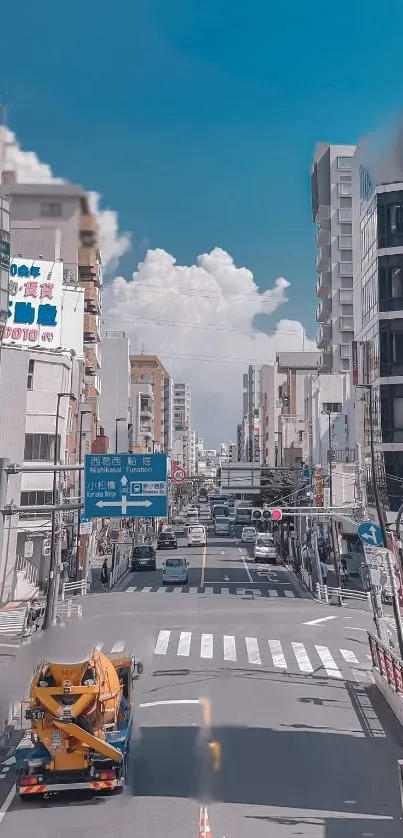 Urban street with skyscrapers and blue sky wallpaper.