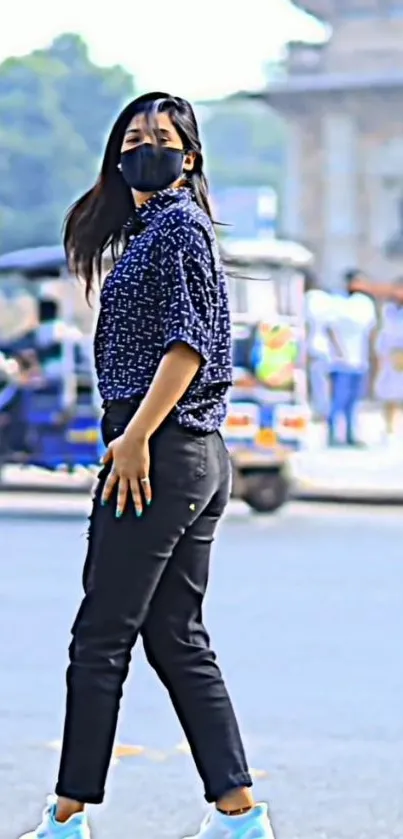 Person in casual attire walking in vibrant urban scene.