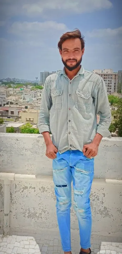 Stylish person on a rooftop with city skyline in the background.