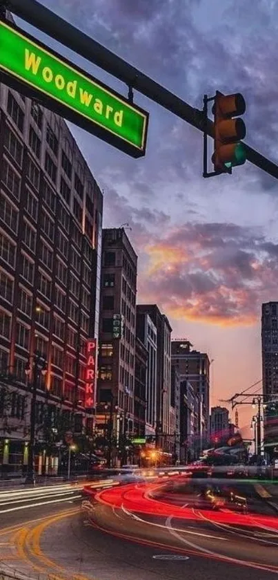 Urban sunset view on city street with traffic lights and buildings.