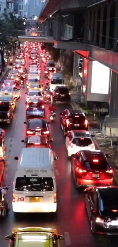 Urban night traffic with glowing red taillights.