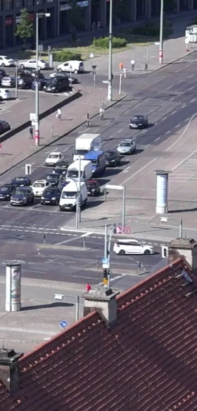 Busy urban intersection with cars and city architecture.