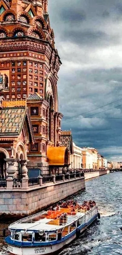 Historic building by a river under a dramatic sky.