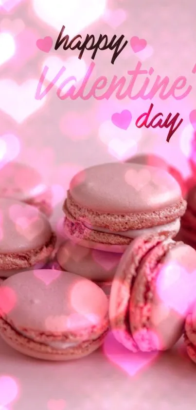 Valentine's Day wallpaper with pink macarons and heart decorations.