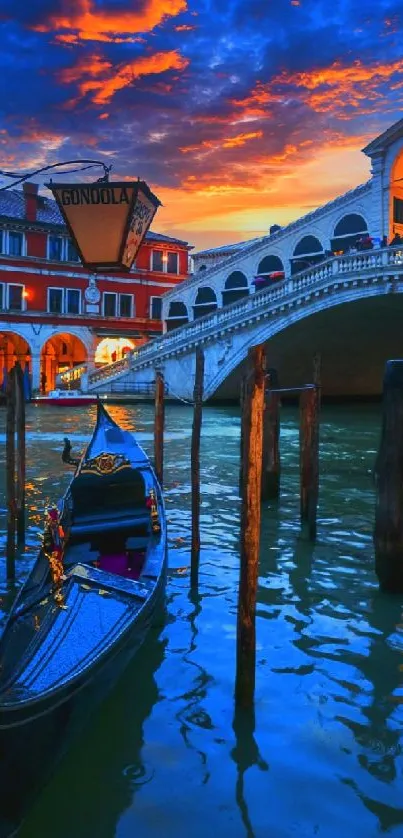 Gondola under Venice's Rialto Bridge at vibrant sunset.