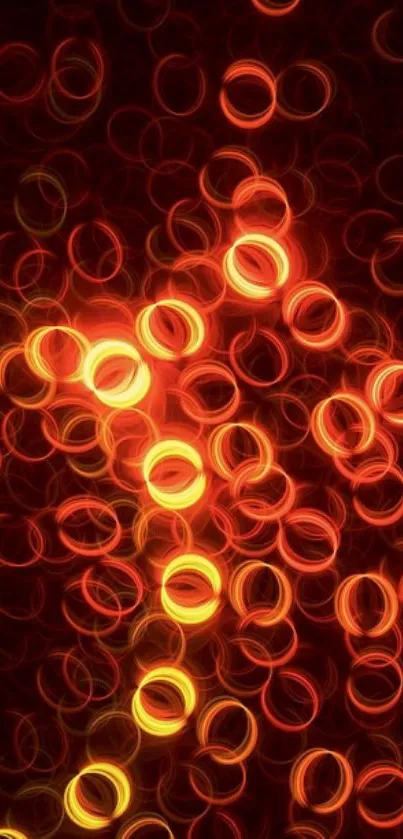 Abstract fiery circles of light on dark background wallpaper.