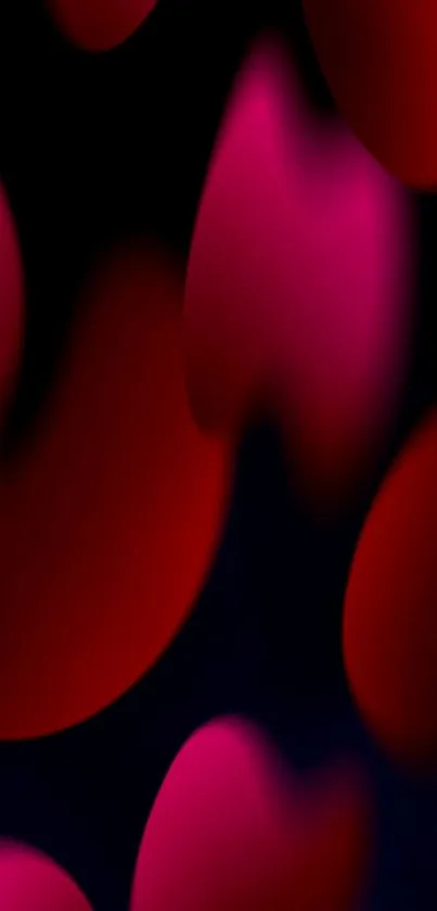 Abstract red and pink gradient mobile wallpaper with dark background.