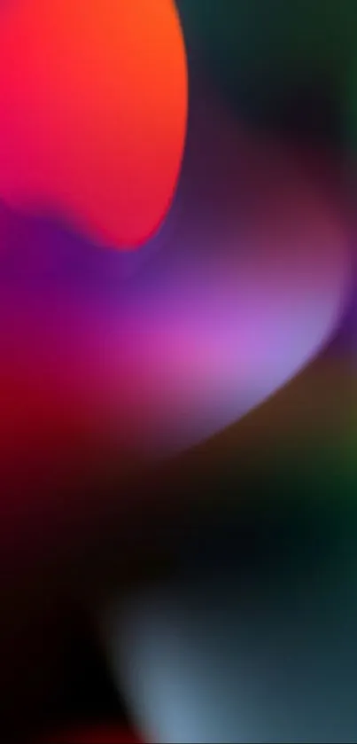 Abstract vibrant wallpaper with red and purple gradient colors.