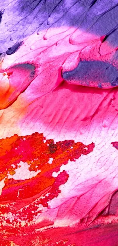 Vibrant abstract paint texture wallpaper with red, pink, orange, and purple hues.