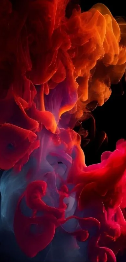 Vibrant red and orange smoke abstract art on black background.