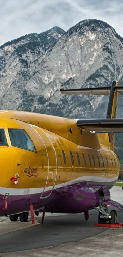 Yellow airplane with mountain backdrop, vibrant colors.