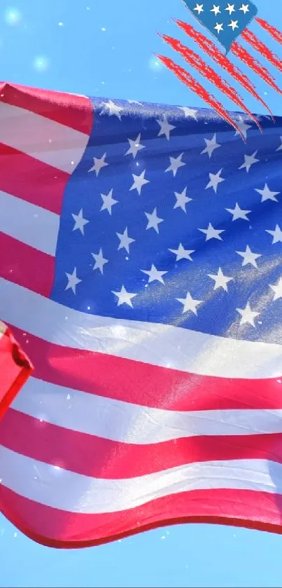 American flag waving against clear blue sky.