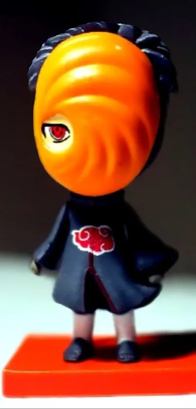 Anime figurine with vibrant orange mask.