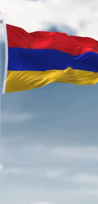 Armenian flag waving in the sky with vibrant red, blue, and yellow colors.