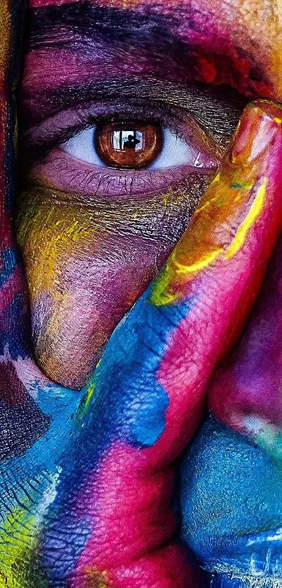 Close-up of an eye with vibrant, colorful paint design.