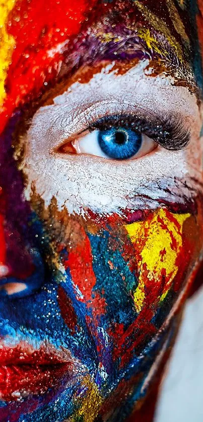 Vibrant painted face with striking blue eye close-up wallpaper.