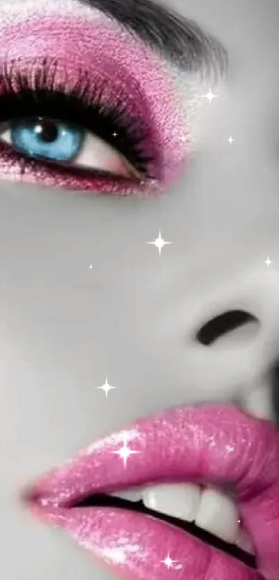 Artistic face with vibrant pink makeup on a mobile wallpaper.