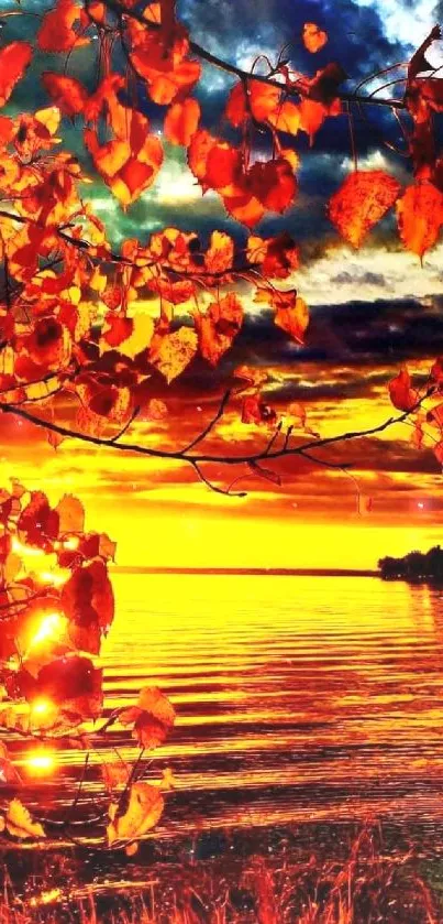 Vivid orange autumn sunset with leaves over a serene lake view.