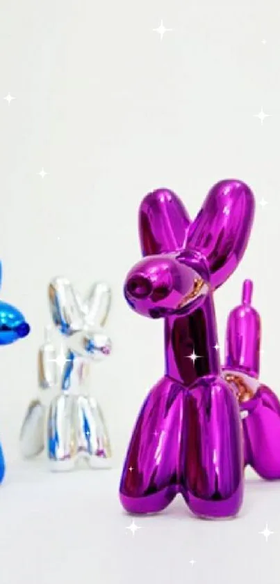 Colorful metallic balloon dog sculptures on white background.