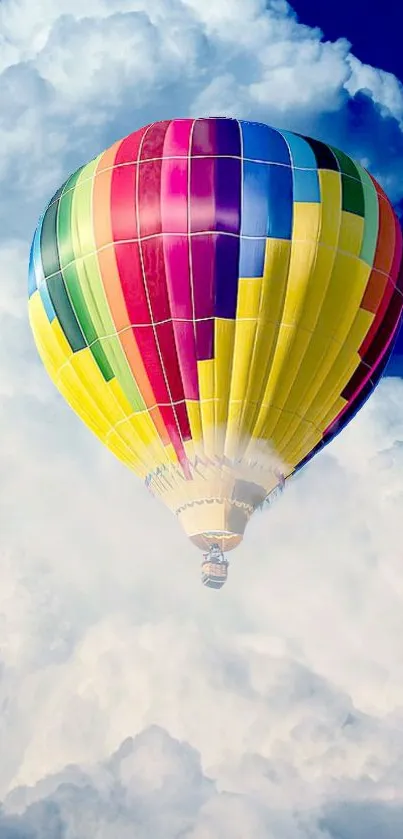 Vibrant hot air balloon floating against a bright blue sky with clouds.