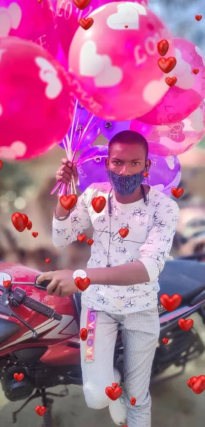 Person with pink love balloons on a motorbike.