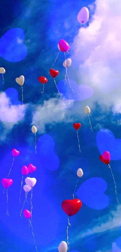 Red and white balloons float in a clear blue sky with scattered clouds.