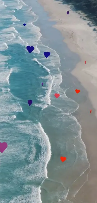 Beach with colorful hearts and ocean waves on a bright day.